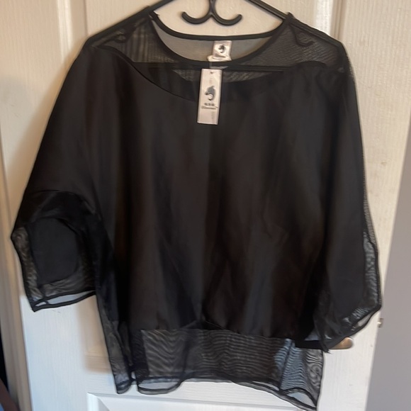 A black three quarter long sleeve women’s blouse with silk and sheer design. - Picture 2 of 7